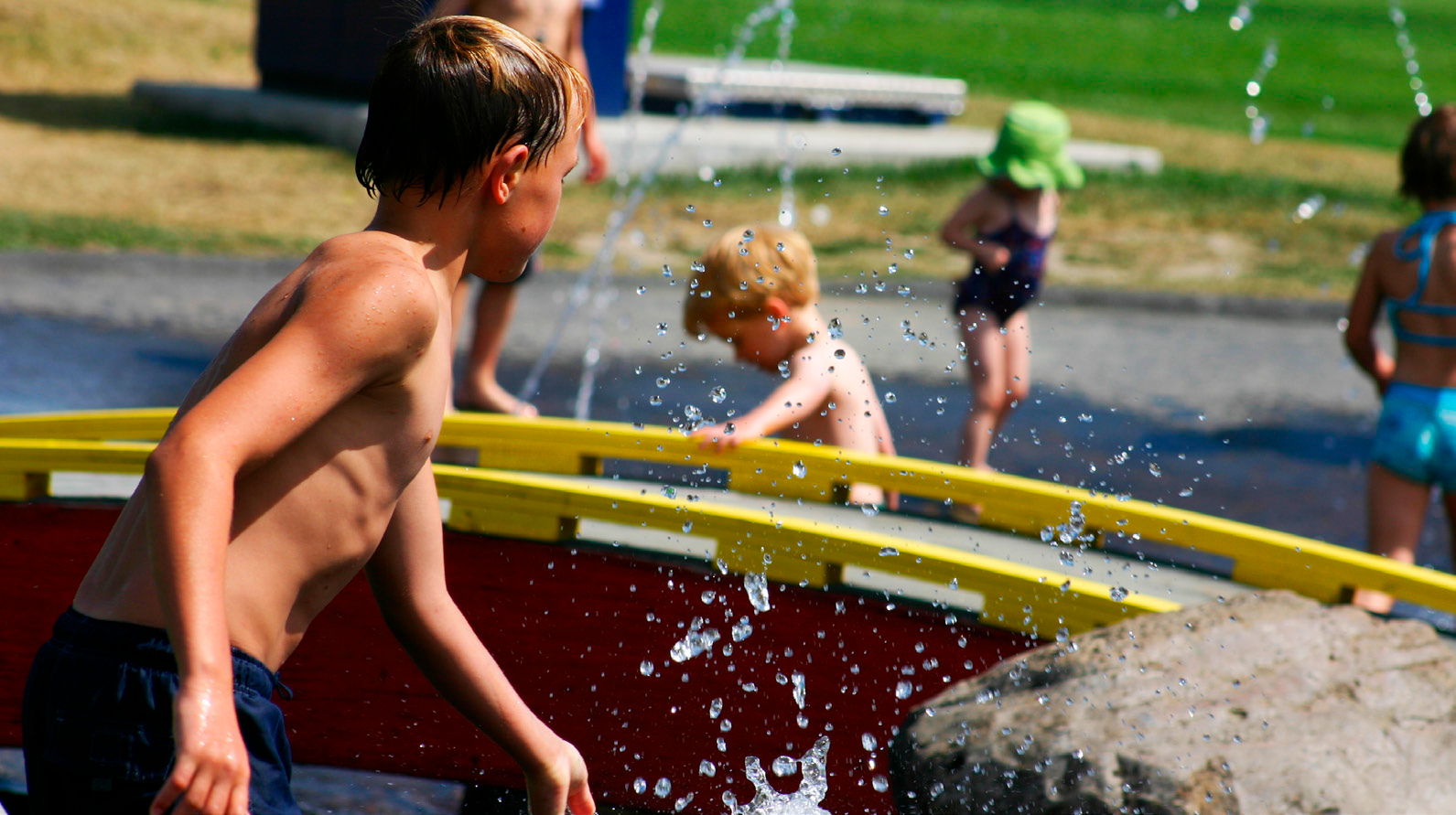 Children playing at outdoor water park