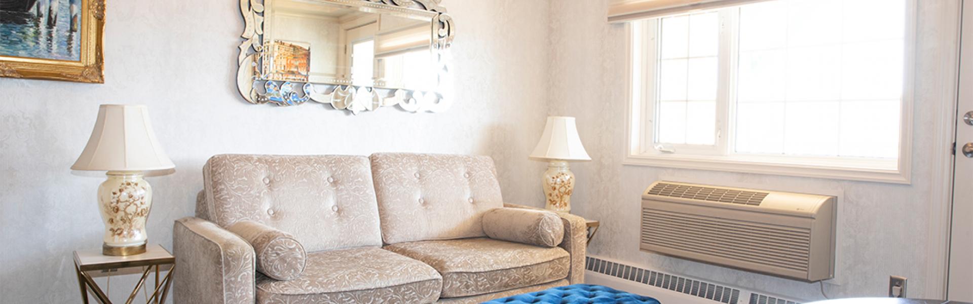 A standard suite with sofa, table and air-condition 