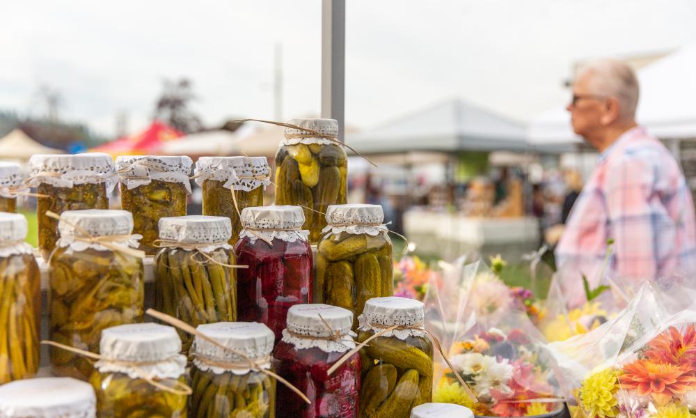 Canned preserves on display for sale at a market