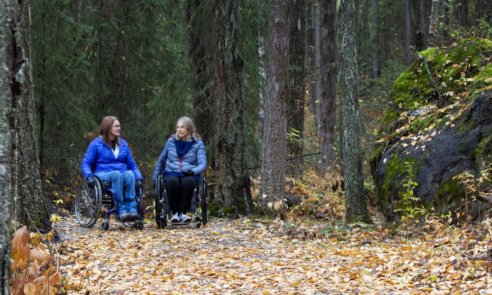 Two women in wheelchairs exploring the Claymine Low Mobility Trail