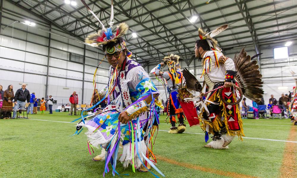 Indigenous dancers dancing at the annual Pow Wow