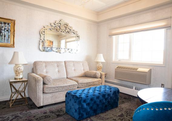 A standard suite with sofa, table and air-condition 