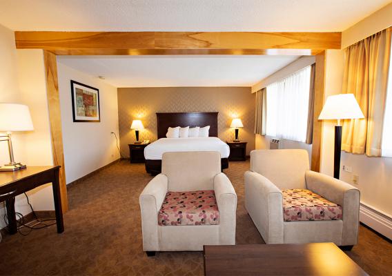 Spacious guest rooms with amenities , desks ,sofas .