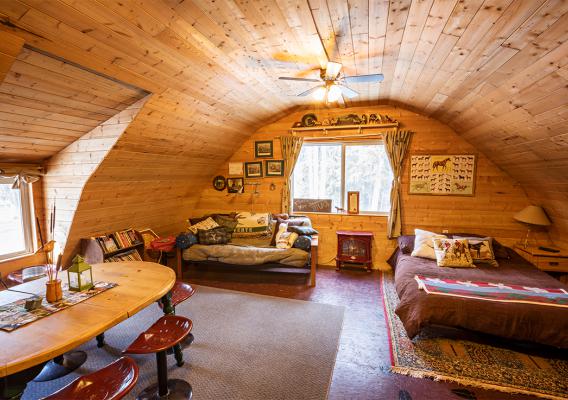 Spacious and king size bedroom with seating and dining area and Wood-burning stove